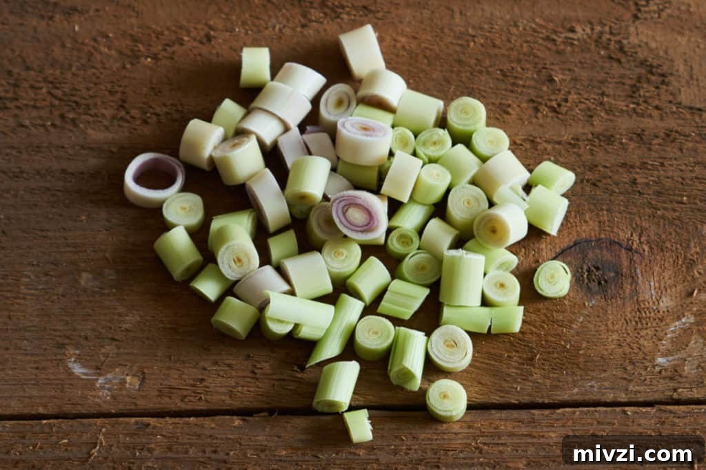 Diced lemongrass on a wooden surface.