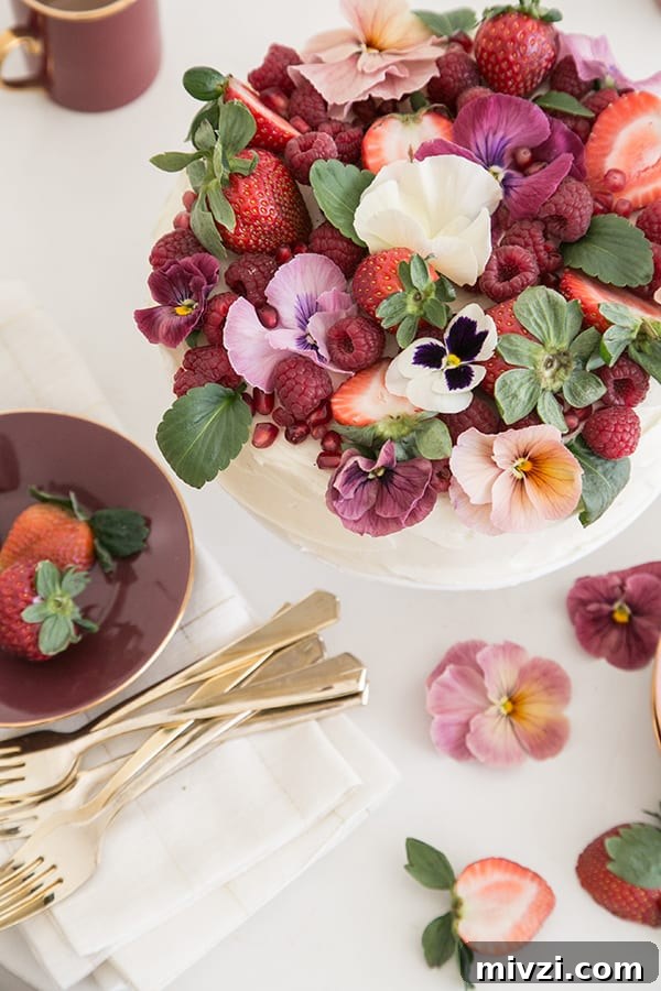 Pink Velvet Cake Recipe with Simple Decorating Tips 6 top down table shot of cake and strawberries