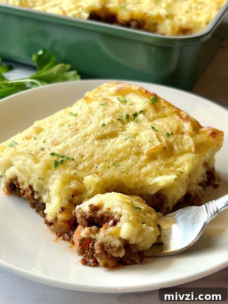 Classic Shepherd's Pie Recipe with Savory Beef and Mashed Potato Topping 10 Served shepherd's pie with a golden potato topping.