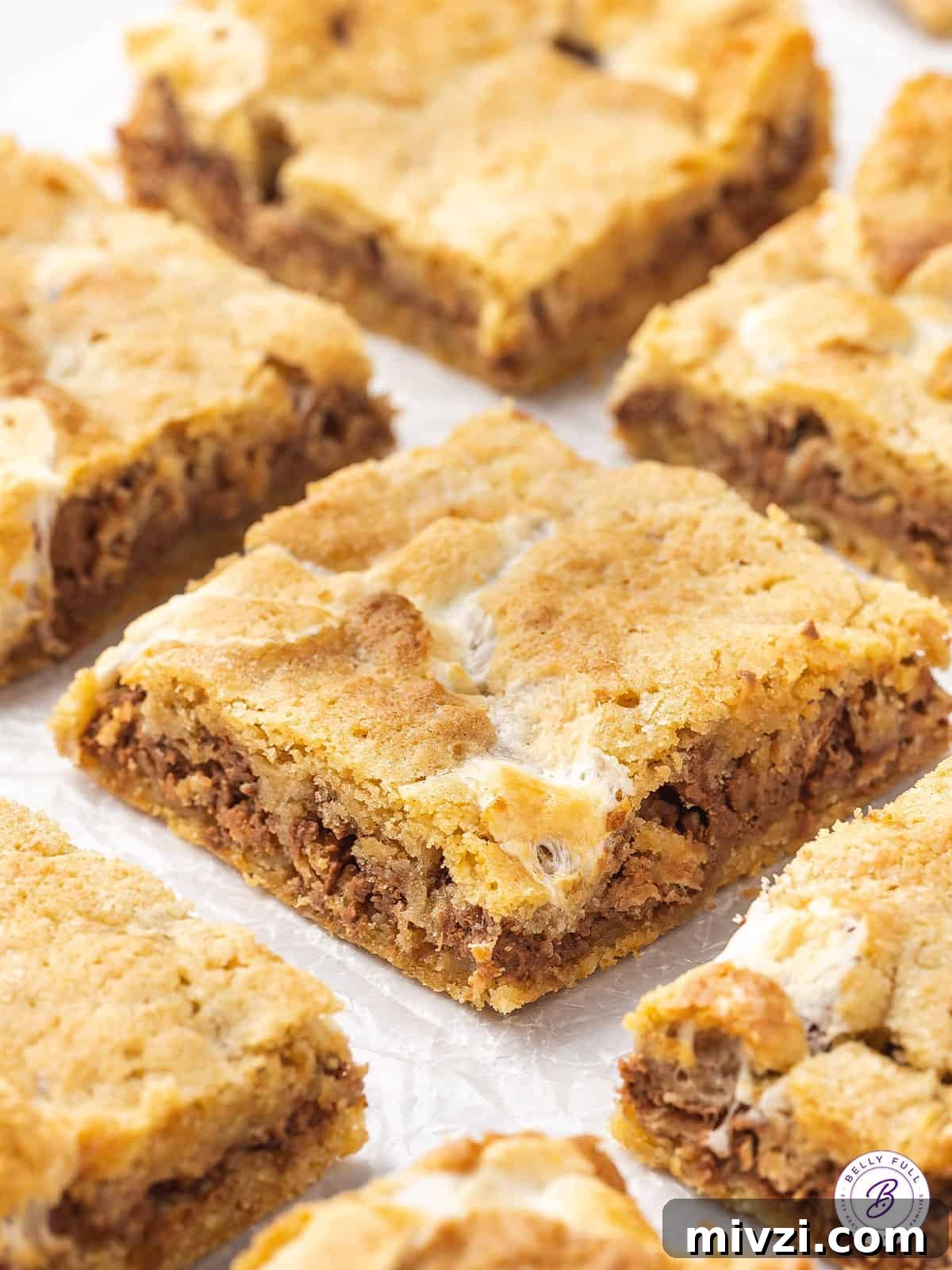 Kit Kat S'mores Bars Recipe — Crispy Chocolate Graham Squares 5 s'mores dessert bar on parchment paper