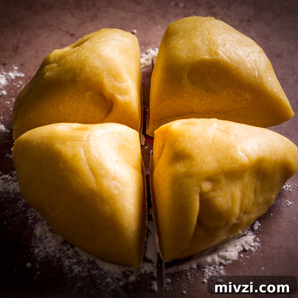 Homemade Pappardelle Recipe: Fresh Pasta from Scratch 12 Pasta dough that's been cut into four equal pieces.