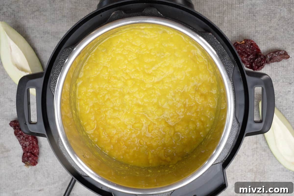 Tangy Raw Mango Dal Recipe for Flavorful Indian Lentils 5 Mashed dal in instant pot.