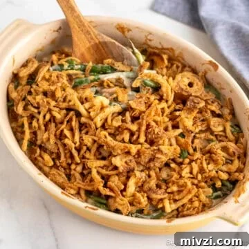 Homemade Green Bean Casserole in a yellow baking dish.