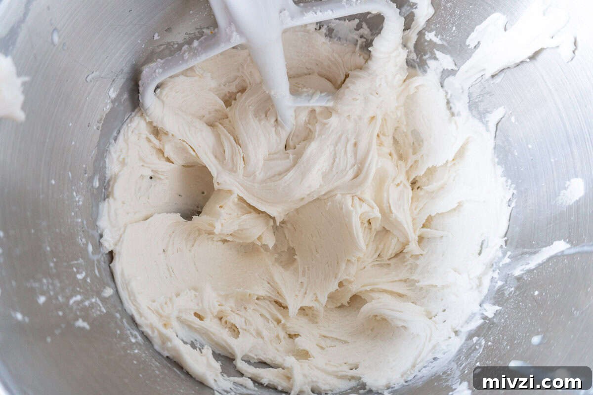 Delicious Birthday Cupcake Recipes for Any Celebration 11 white frosting in bowl stainless steel bowl.
