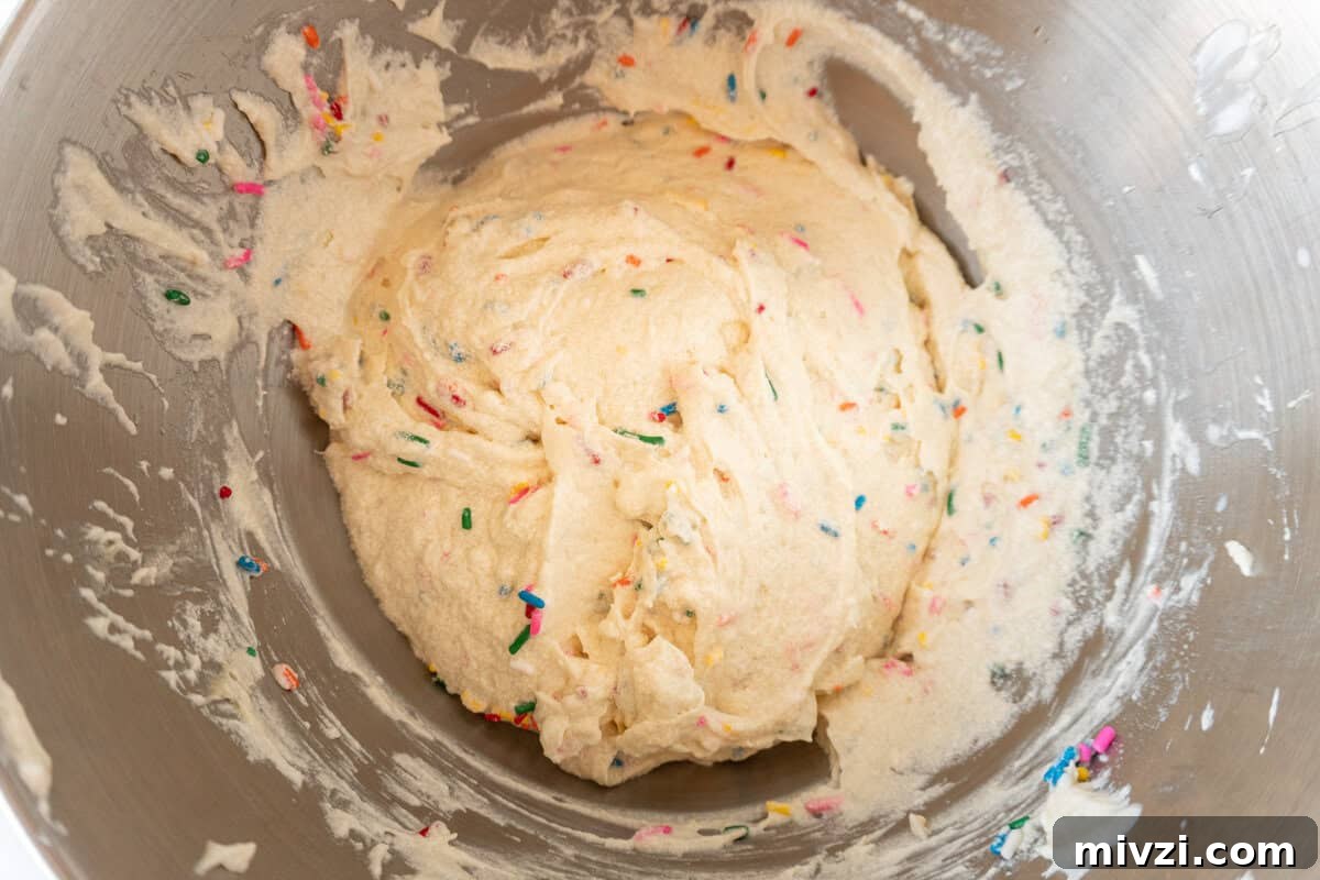 Delicious Birthday Cupcake Recipes for Any Celebration 9 sprinkles mixed into batter.
