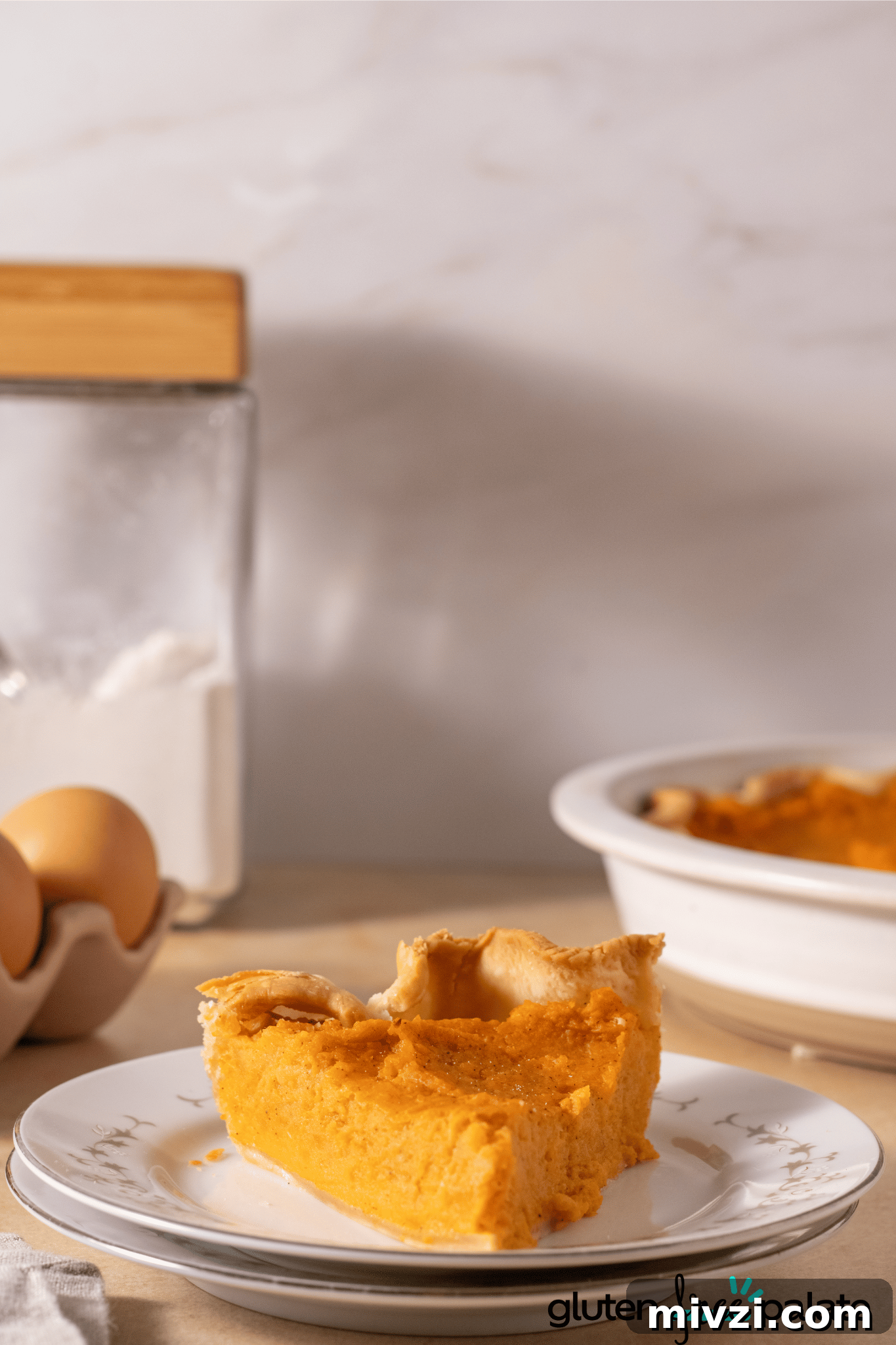 Gluten-Free Sweet Potato Pie Recipe: Simple, Creamy Dessert 5 Gluten-Free Sweet Potato Pie on a white serving plate.