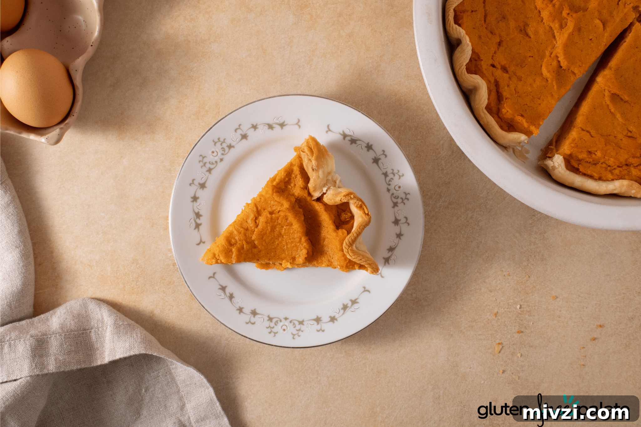 Gluten-Free Sweet Potato Pie Recipe: Simple, Creamy Dessert 8 Gluten-Free Sweet Potato Pie on a white serving plate.