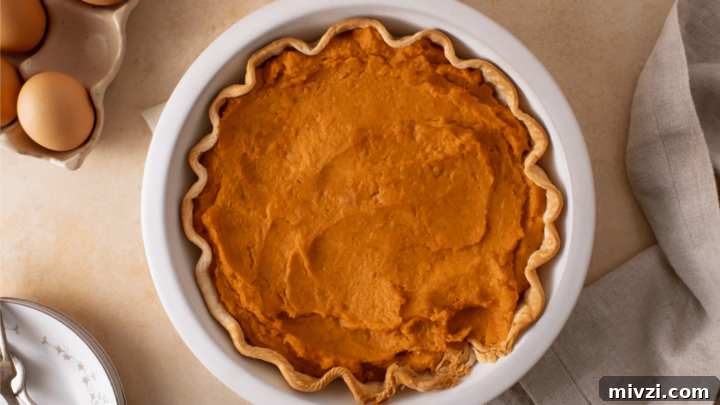 Gluten-Free Sweet Potato Pie in a white pie dish