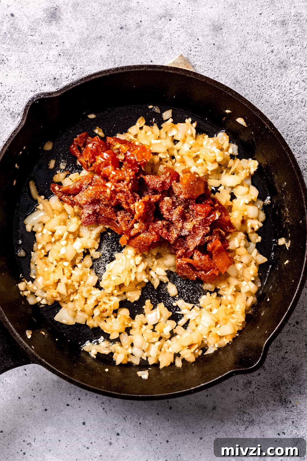 Sautéed onions and garlic in a skillet.