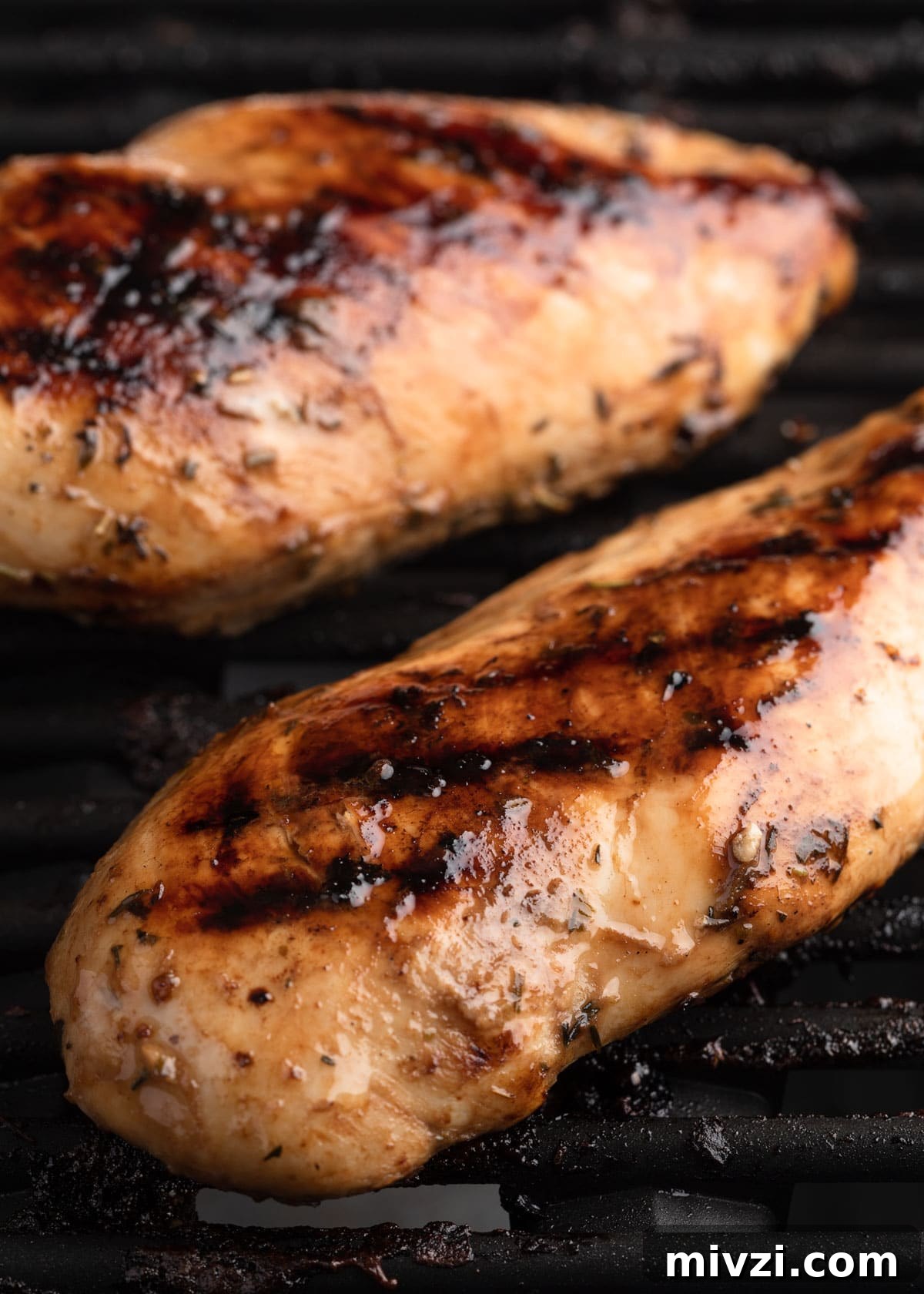 Balsamic-Marinated Chicken Breasts for Juicy Weeknight Meals 7 two cooked balsamic marinated chicken breasts on grill grates