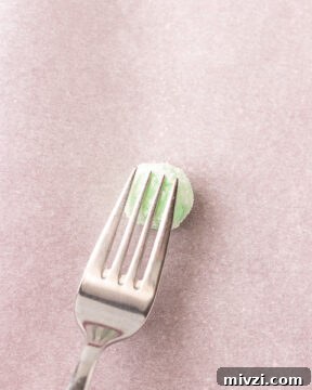 Keto Buttercream Mints: Low-Carb Peppermint Candy Recipe 11 Flatten the dough balls with a fork.