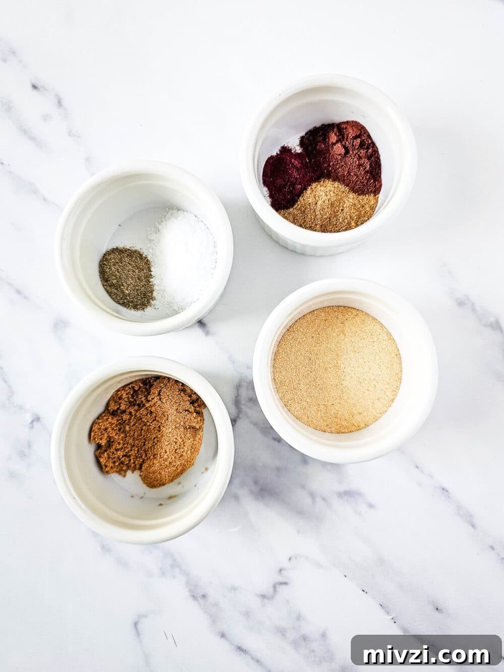 ingredients in separate bowls for keto steak taco seasoning