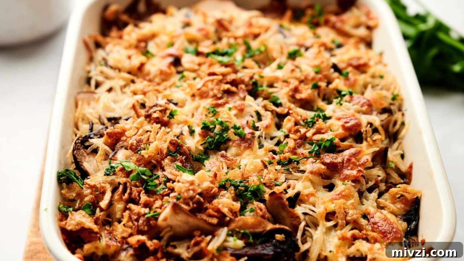 35 Comforting Casserole Recipes to Rely on Tonight 22 A bowl of pasta with lemon slices and parmesan cheese.