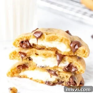 Cream cheese stuffed cookies, broken in half and stacked on top of each other