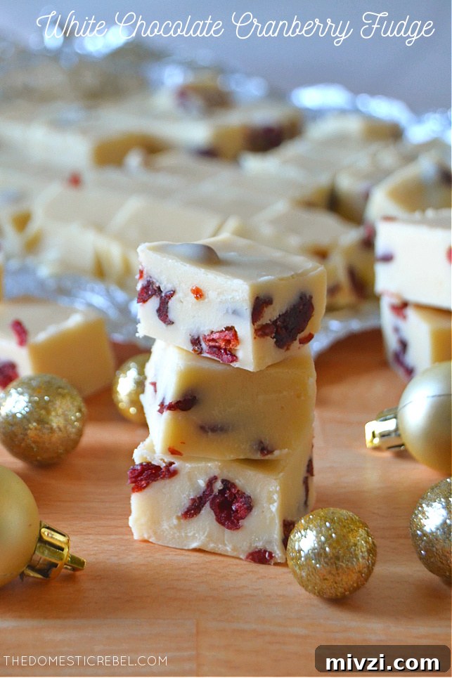Creamy White Chocolate Cranberry Fudge Recipe 2 Small trio stack of white chocolate cranberry fudge with mini gold ornaments