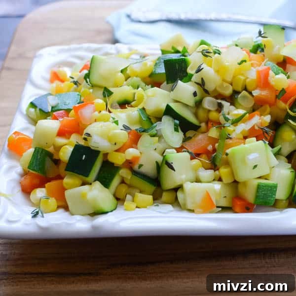 Confetti Corn: Colorful Baked Corn Recipe with Rainbow Veggies 8 sautéed vegetables on a platter.