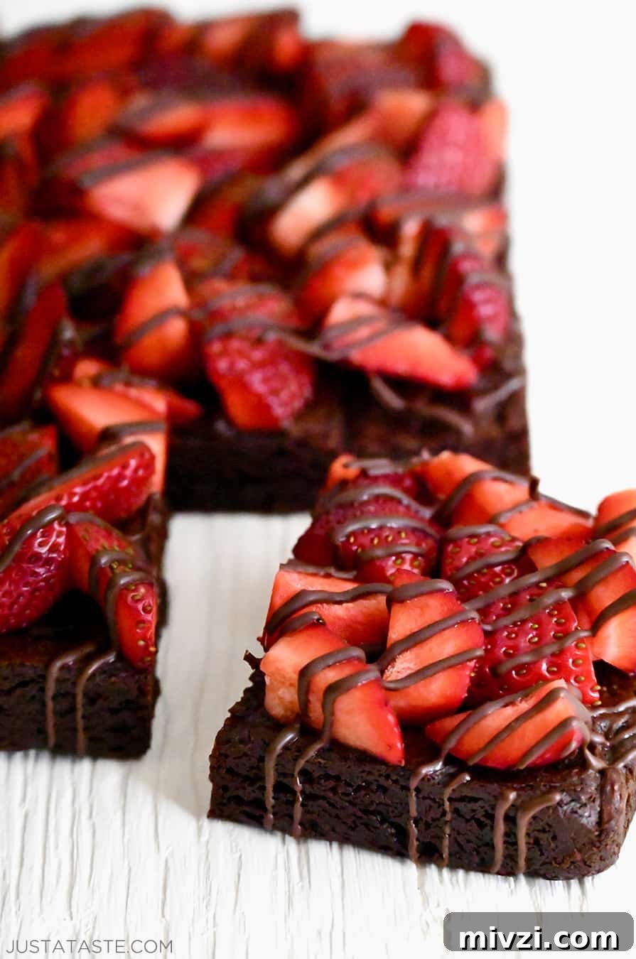 Romantic Valentine’s Day Dessert Ideas and Recipes 20 The corner piece of Chocolate-Covered Strawberry Brownies