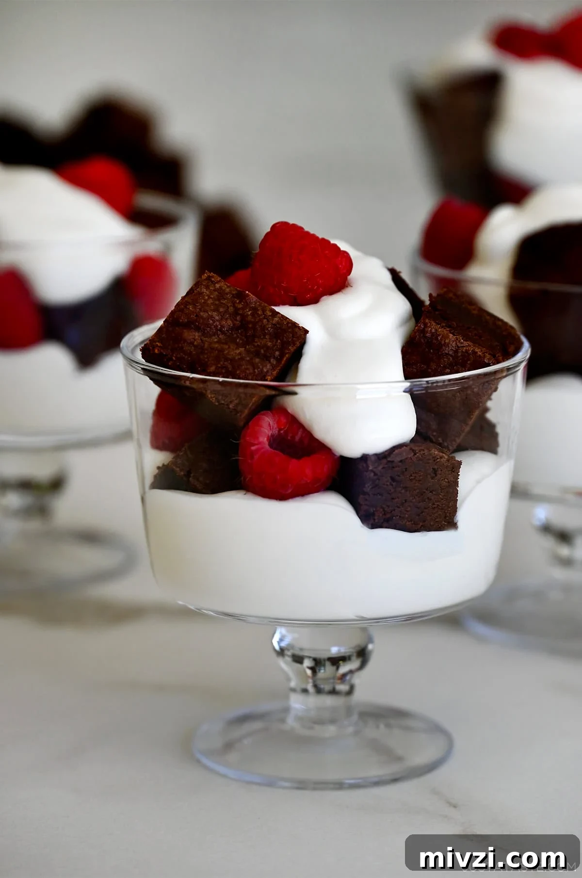 Romantic Valentine’s Day Dessert Ideas and Recipes 26 Mini brownie trifles with layers of brownie pieces, juicy raspberries and whipped cream.