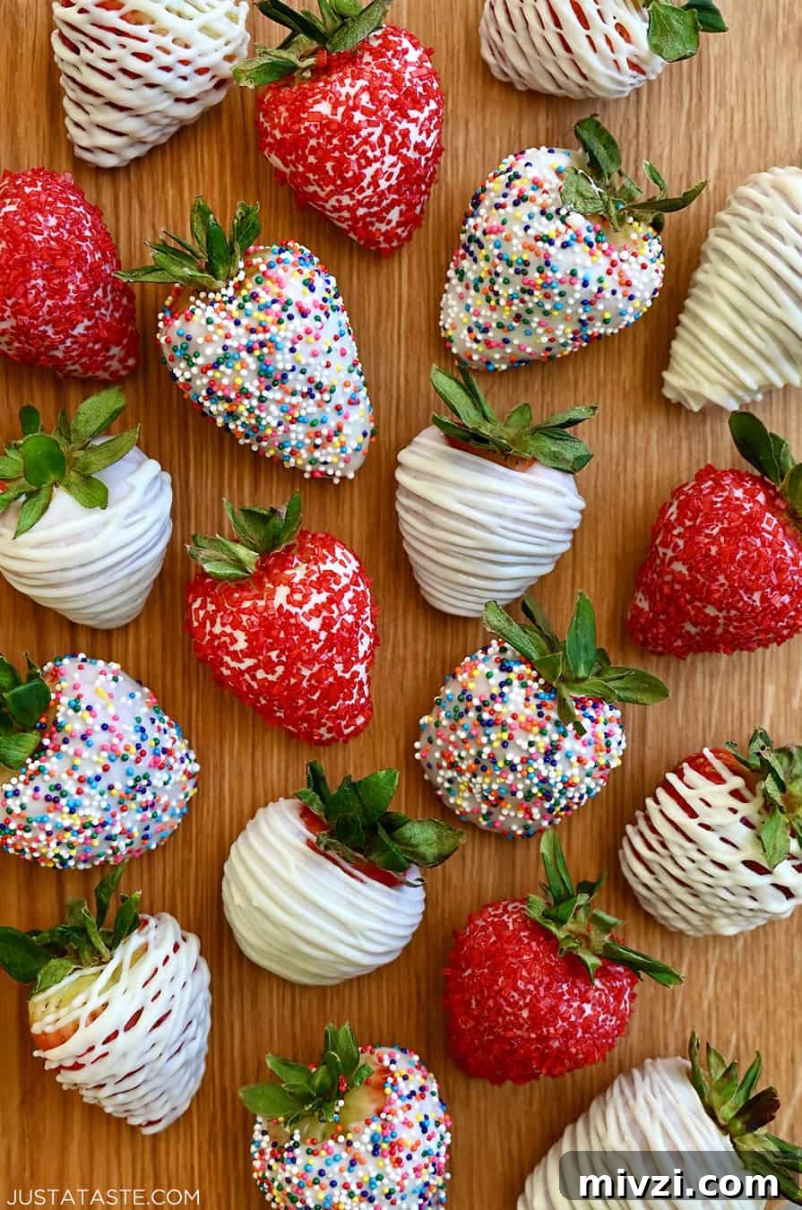 Romantic Valentine’s Day Dessert Ideas and Recipes 8 A top-down view of homemade White Chocolate-Covered Strawberries, including some decorated with rainbow sprinkles