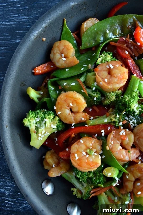Make-Ahead Shrimp Stir-Fry: Freezer-Friendly Meal Prep 3 close up view of shrimp stir fry in the skillet