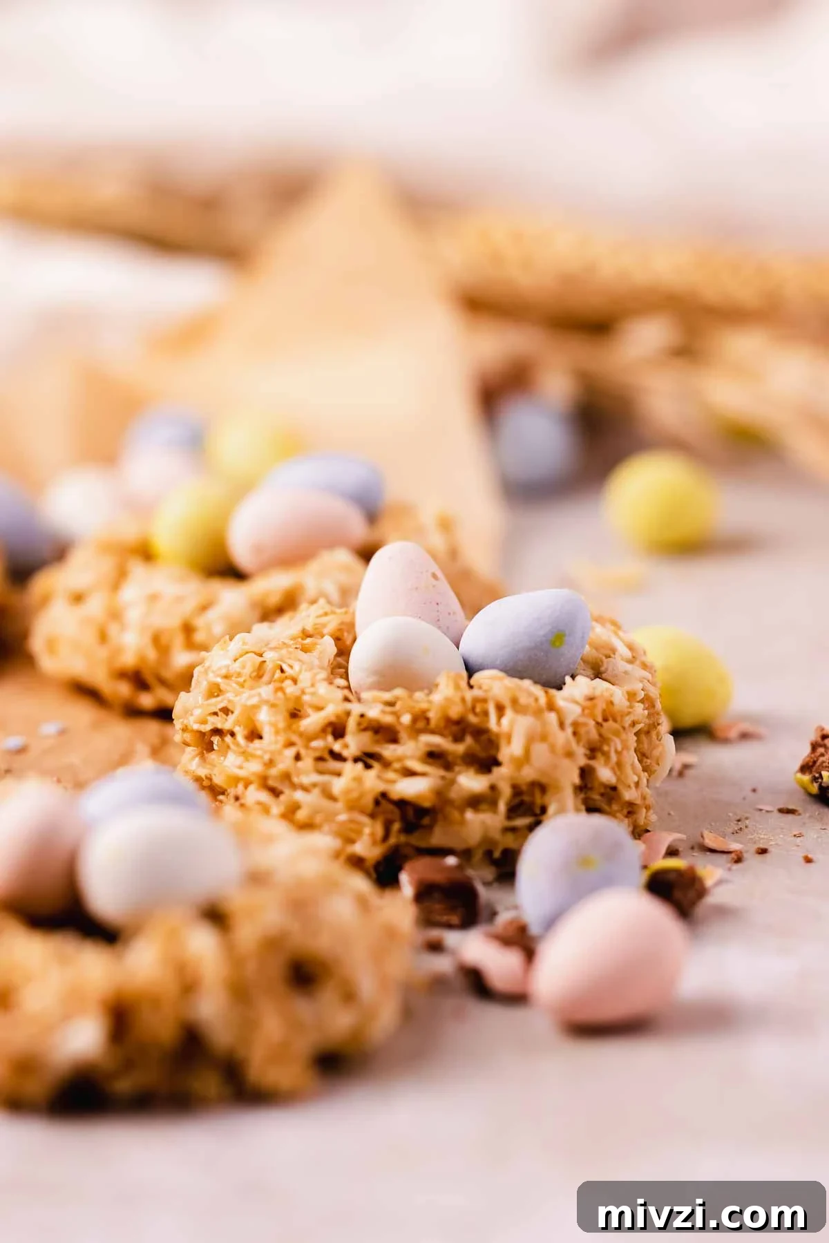 no bake cookie in a nest shape with pastel candy coated mini eggs