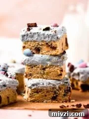 stack of mini egg cookie bars with cream cheese frosting