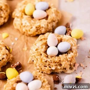 birds nest cookies on parchment paper with speckled mini eggs