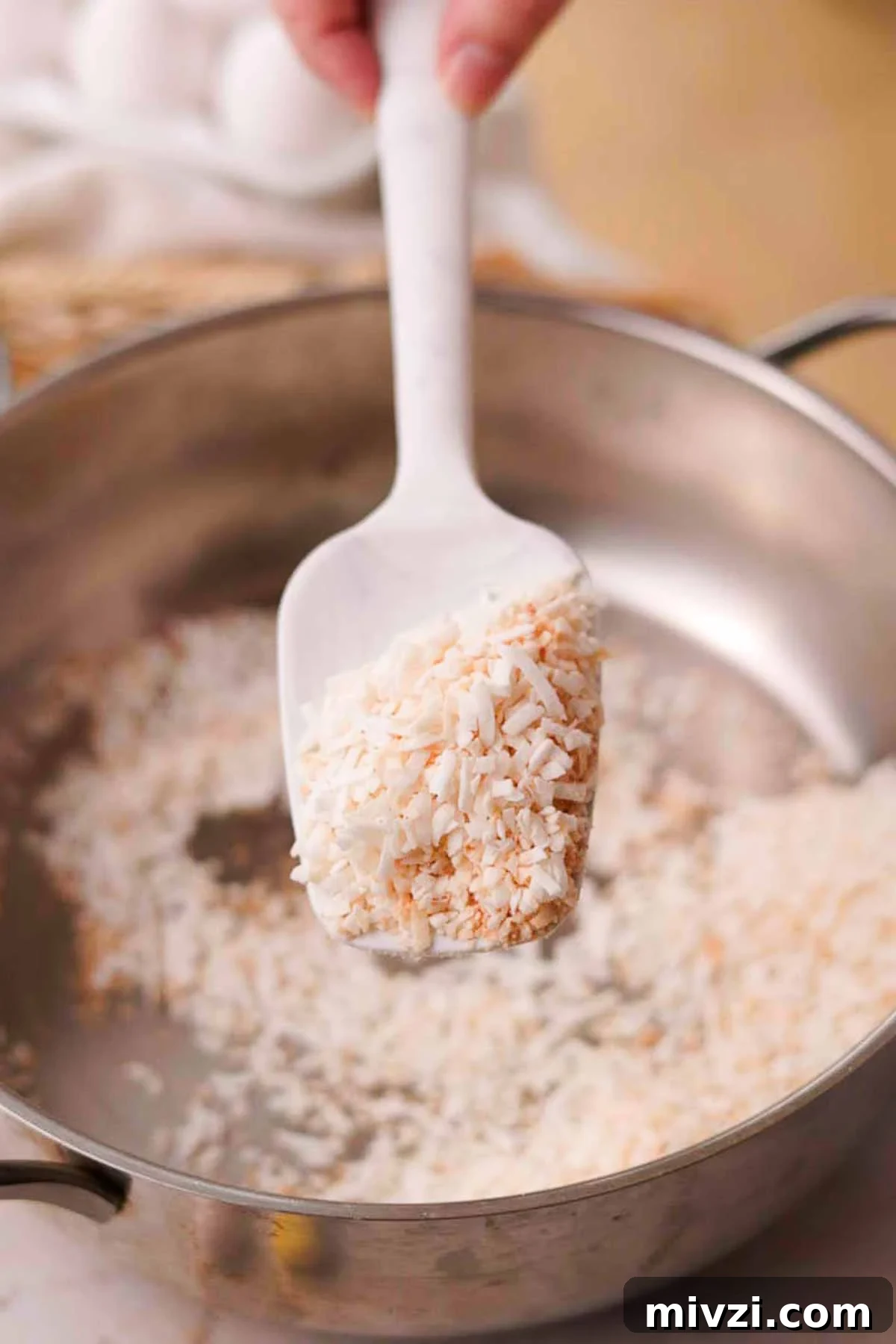 toasting shredded coconut in a dry pan