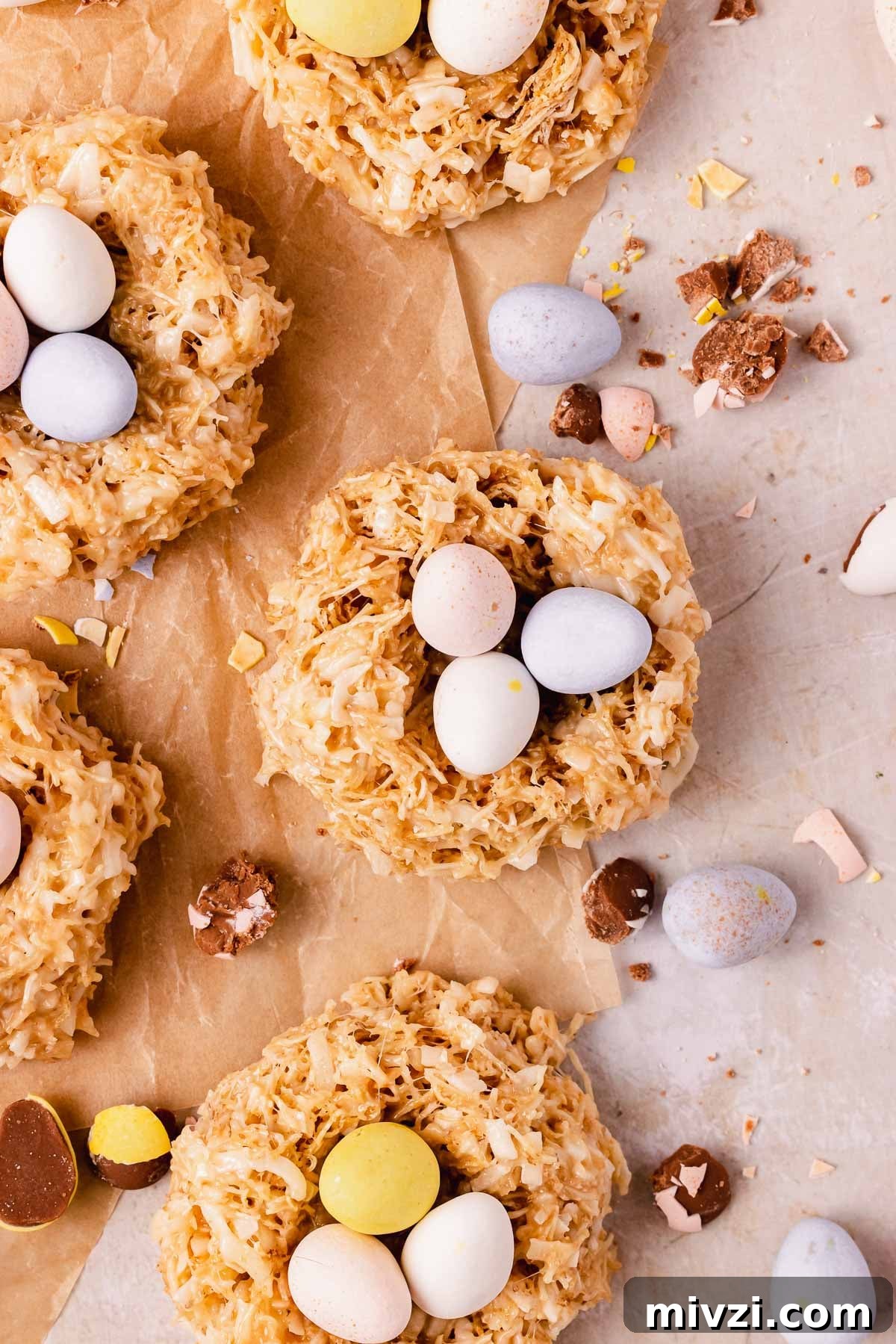 nest cookies on parchment paper with coconut and white chocolate