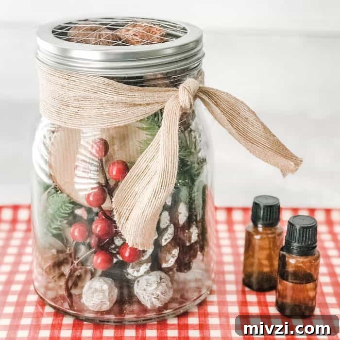 Christmas Potpourri Diffuser Ideas for Festive Home Fragrance 9 DIY holiday diffuser with two essential oil bottles beside it