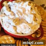 Creative Recipes for Leftover Salmon: 25 Ways to Reuse Fillets 11 Smoked Salmon Dip Served in a red dish with ritz crackers around it