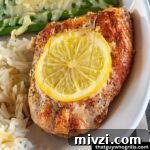 Creative Recipes for Leftover Salmon: 25 Ways to Reuse Fillets 3 Grilled Salmon with lemon slice white rice and cheesy asparagus