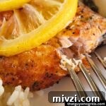 Creative Recipes for Leftover Salmon: 25 Ways to Reuse Fillets 4 Grilled Salmon being peeled by a fork