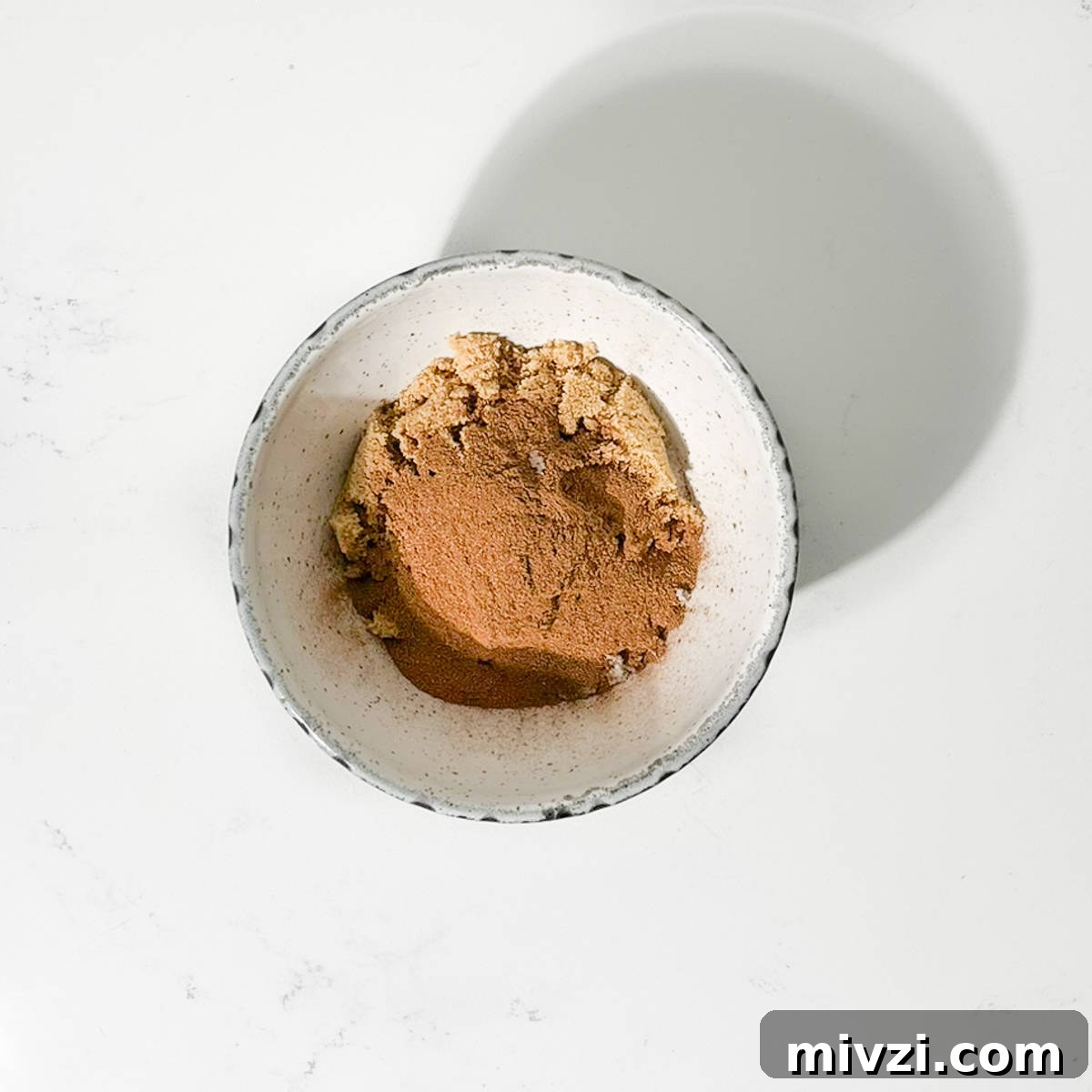 Canned Crescent Dough Cruffins Recipe: Flaky Homemade Pastry in Minutes 5 Mixing the white and brown sugar for the cruffins in a bowl.