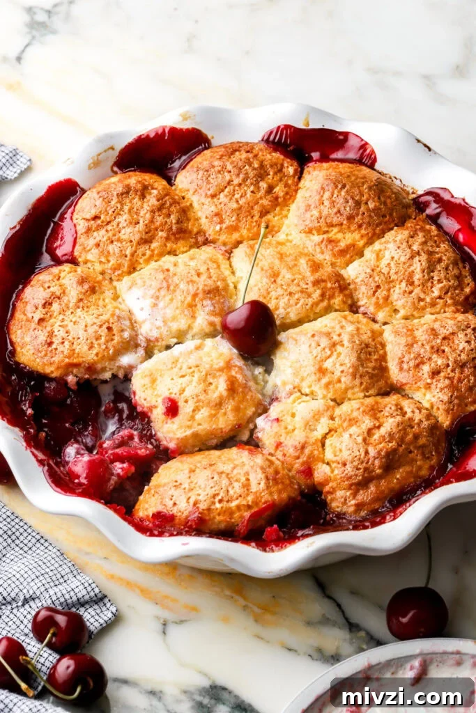 cherry cobbler with a black cherry on top