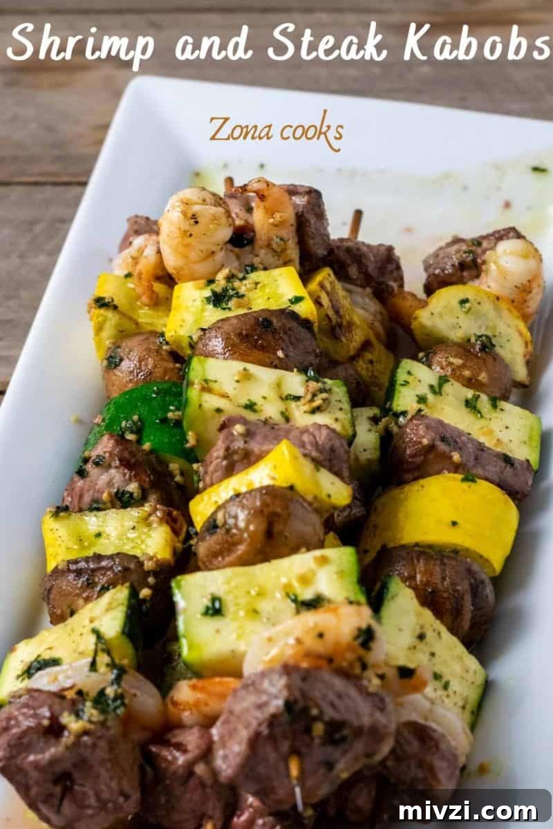 Surf and Turf Shrimp & Steak Kabobs Recipe for Grilling 2 Shrimp and Steak Kabobs on a platter.