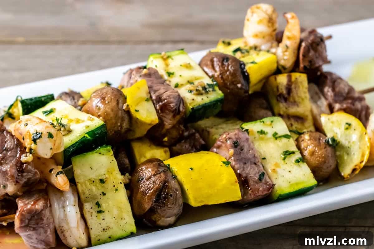 Surf and Turf Shrimp & Steak Kabobs Recipe for Grilling 8 Steak and Shrimp Shish Kabobs on a platter.