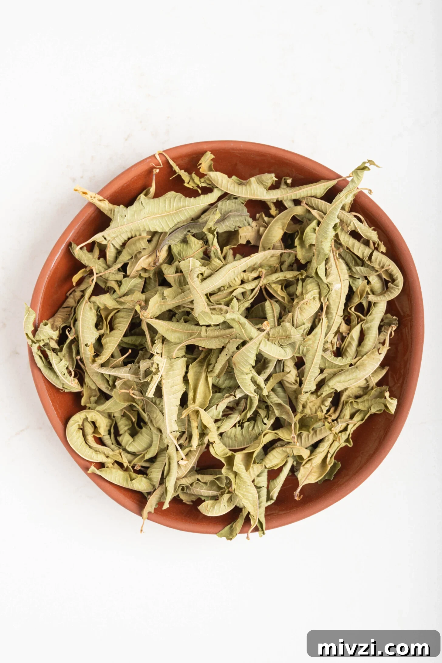 a bowl of dried lemon verbena leaves