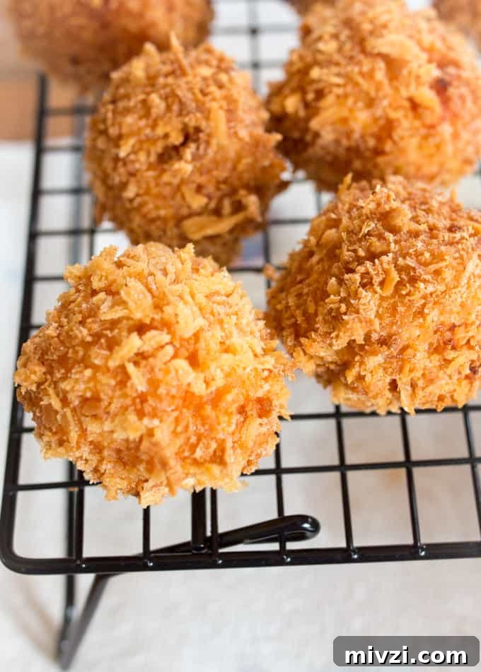 Crispy Tomato Arancini: Golden Fried Risotto Balls with Marinara 4 Creamy Tomato Risotto Balls, filled with creamy boursin cheese, coated in breadcrumbs and fried until golden and crisp.