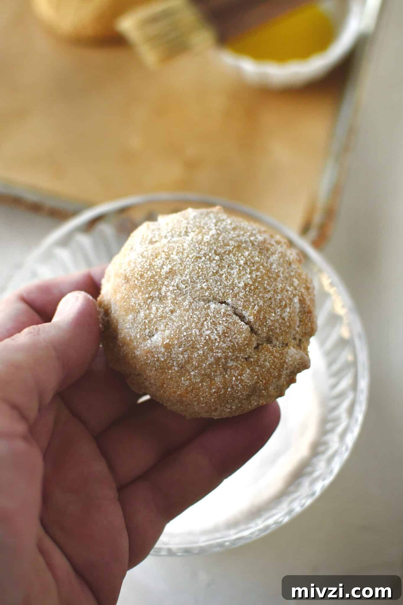 Pumpkin Whoopie Pies Recipe: Soft Spiced Cream-Filled Treats 11 Whoopie pie that has been buttered and dipped in sugar.