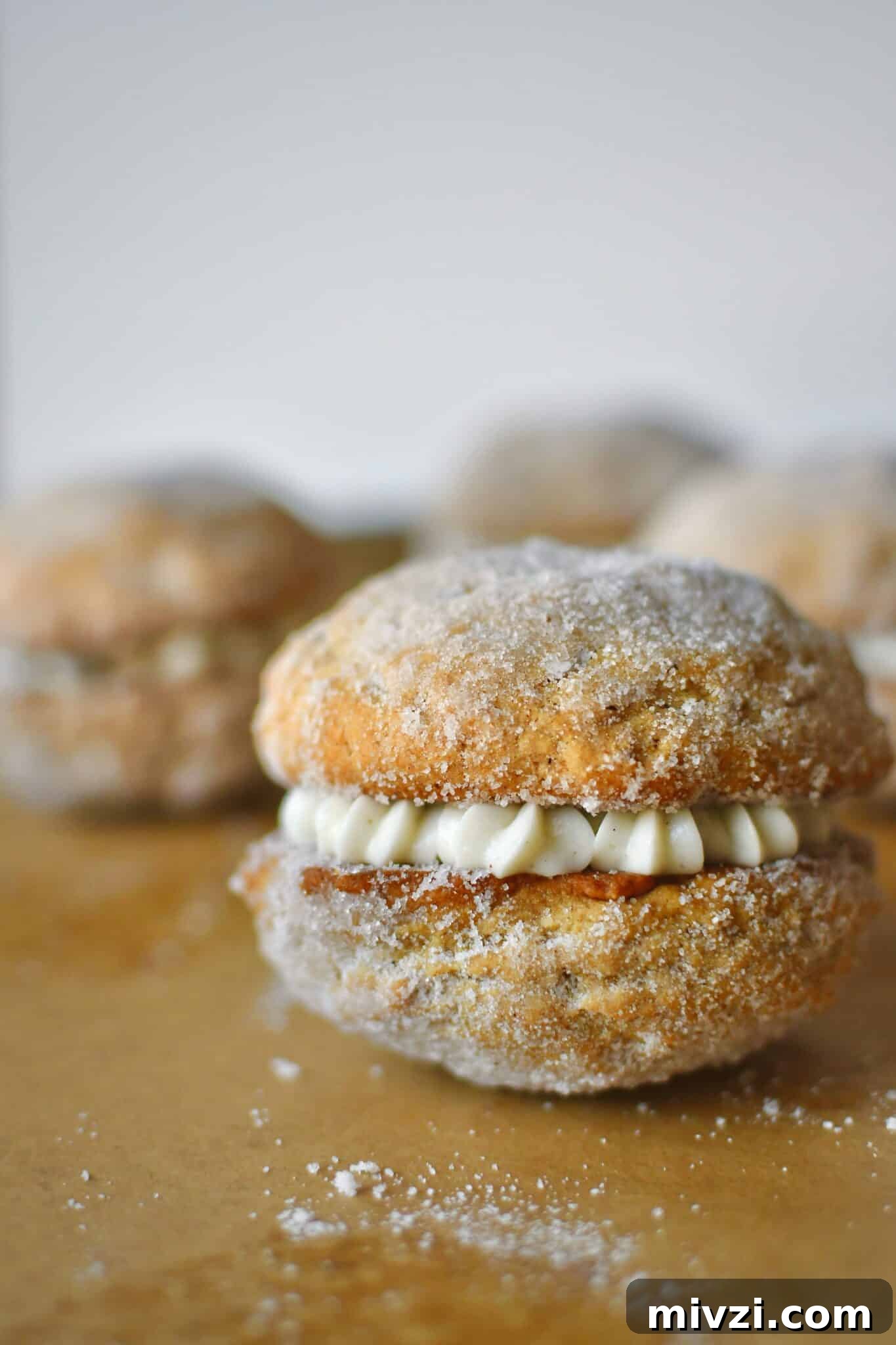 Pumpkin Whoopie Pies Recipe: Soft Spiced Cream-Filled Treats 16 A Pumpkin Whoopie Pie fully assembled on a baking sheet.
