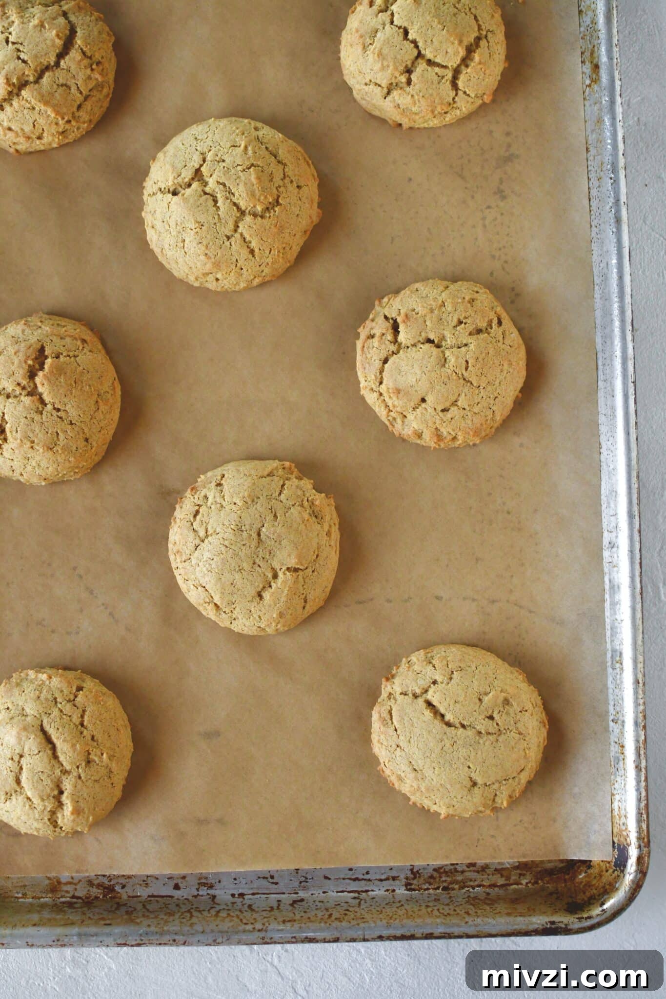Pumpkin Whoopie Pies Recipe: Soft Spiced Cream-Filled Treats 8 Whoopie pies on a sheet pan, after baking.