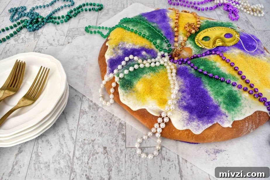 Authentic Mardi Gras King Cake Recipe: Traditional New Orleans Flavor 2 full mardi gras king cake with mardi gras beads and paltes