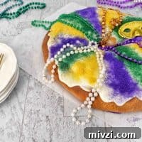 Authentic Mardi Gras King Cake Recipe: Traditional New Orleans Flavor 7 full mardi gras king cake with mardi gras beads and paltes