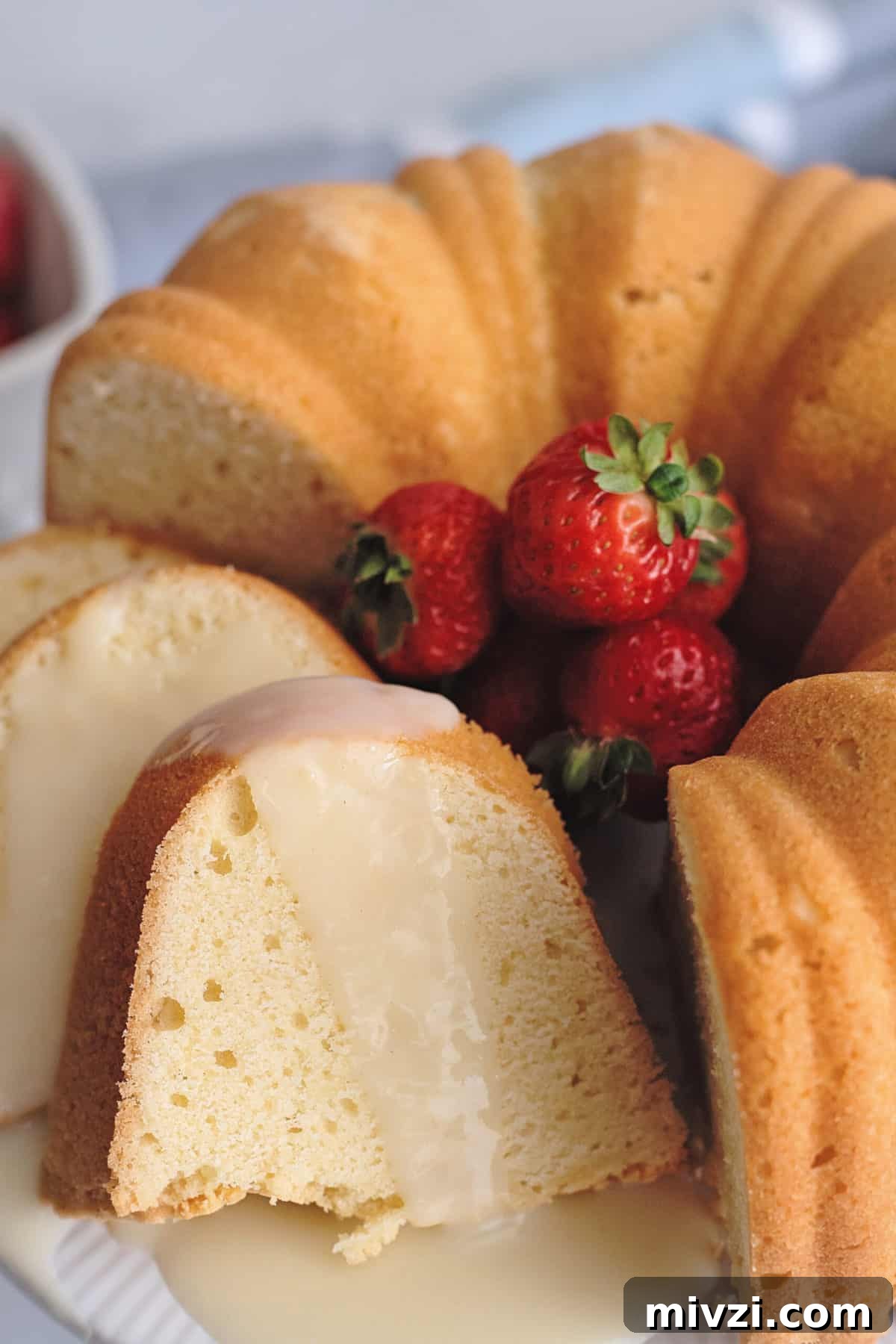 Slice of pound cake with custard sauce.