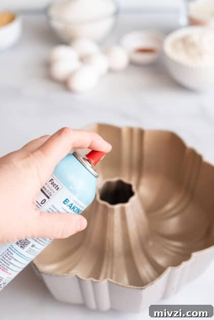 Grease bundt pan with cooking spray.