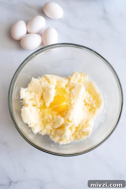 Add eggs to mixing bowl one at a time.