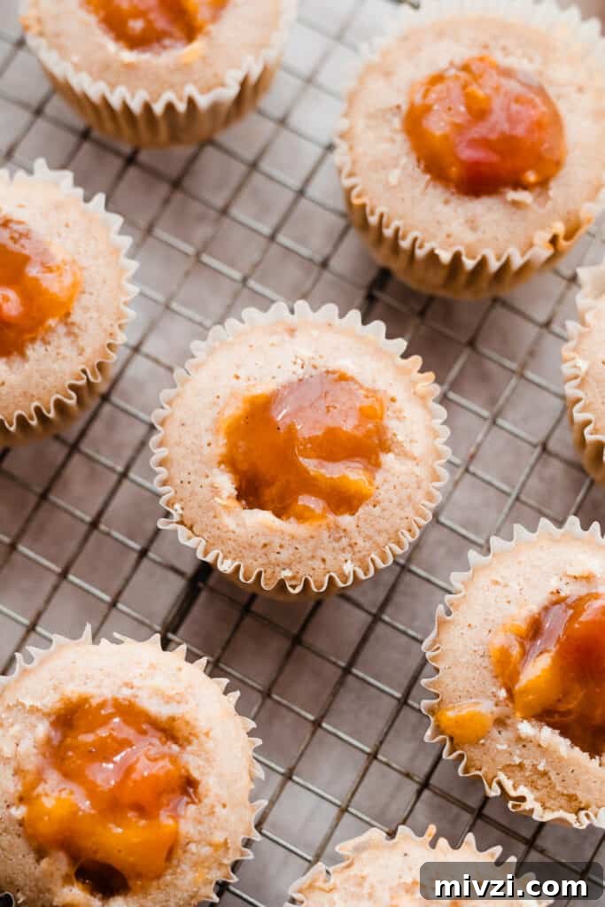 Peach Cupcakes with Cinnamon Cream Cheese Frosting — Summer Dessert Recipe 8 Cupcakes filled with the peach pie filling.