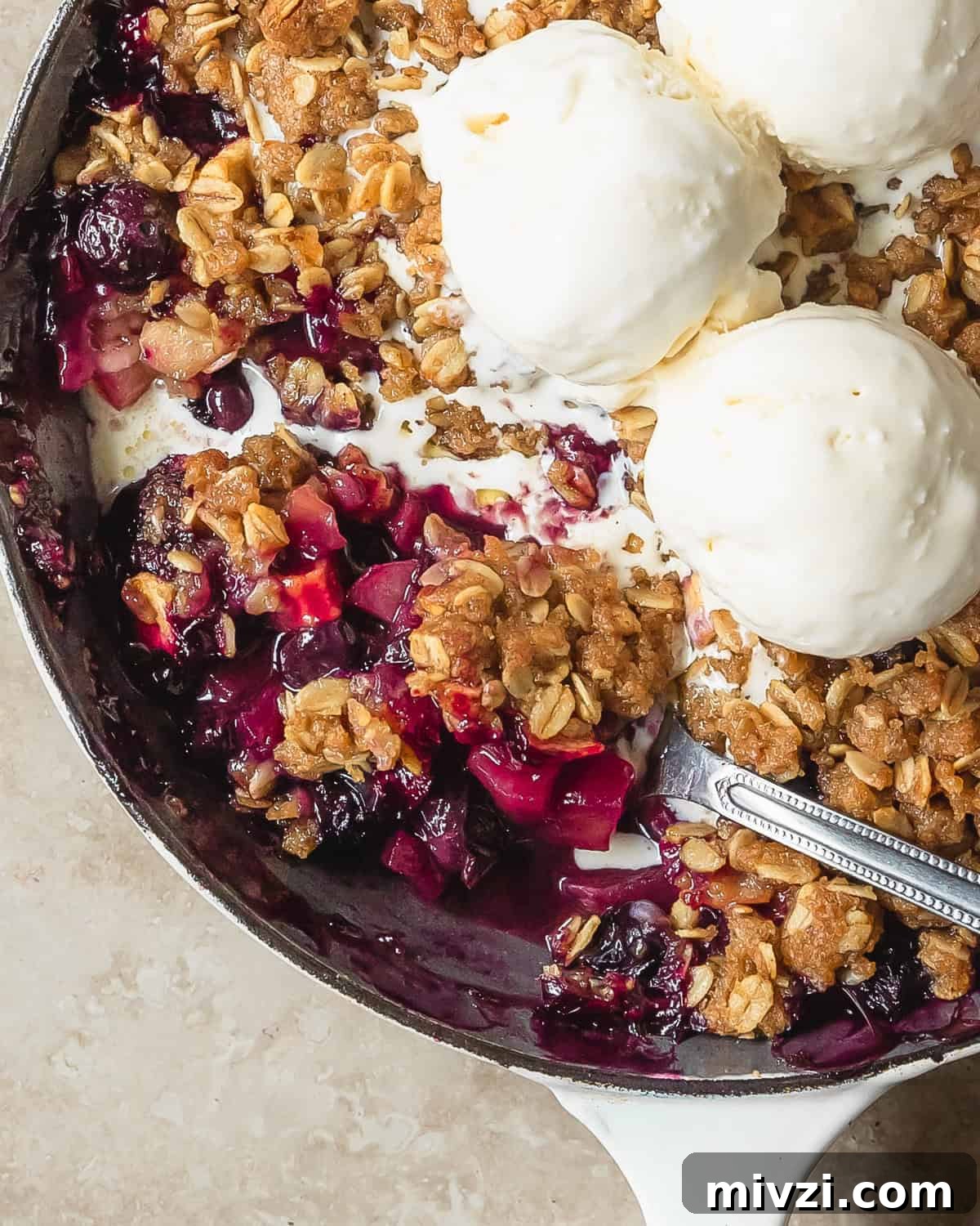 Apple Blueberry Crisp Recipe with Oat Topping 2 Apple blueberry crisp is a cozy, classic crisp filled with fresh, sweet and tart apples and juicy blueberries. This apple crisp with blueberries is topped with a buttery cinnamon spiced brown sugar crumble.