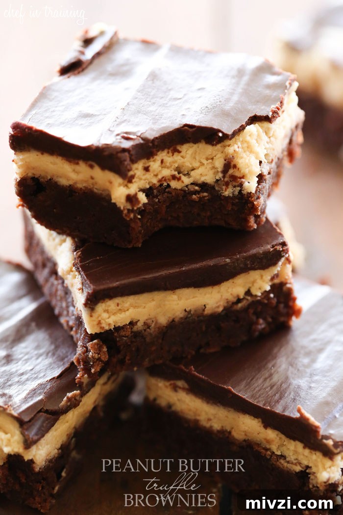 Peanut Butter Truffle Brownies... OH MY GOSH! These are INCREDIBLE! Layers of fudgy brownie, soft truffle and chocolate ganache combine to make one unforgettable dessert!